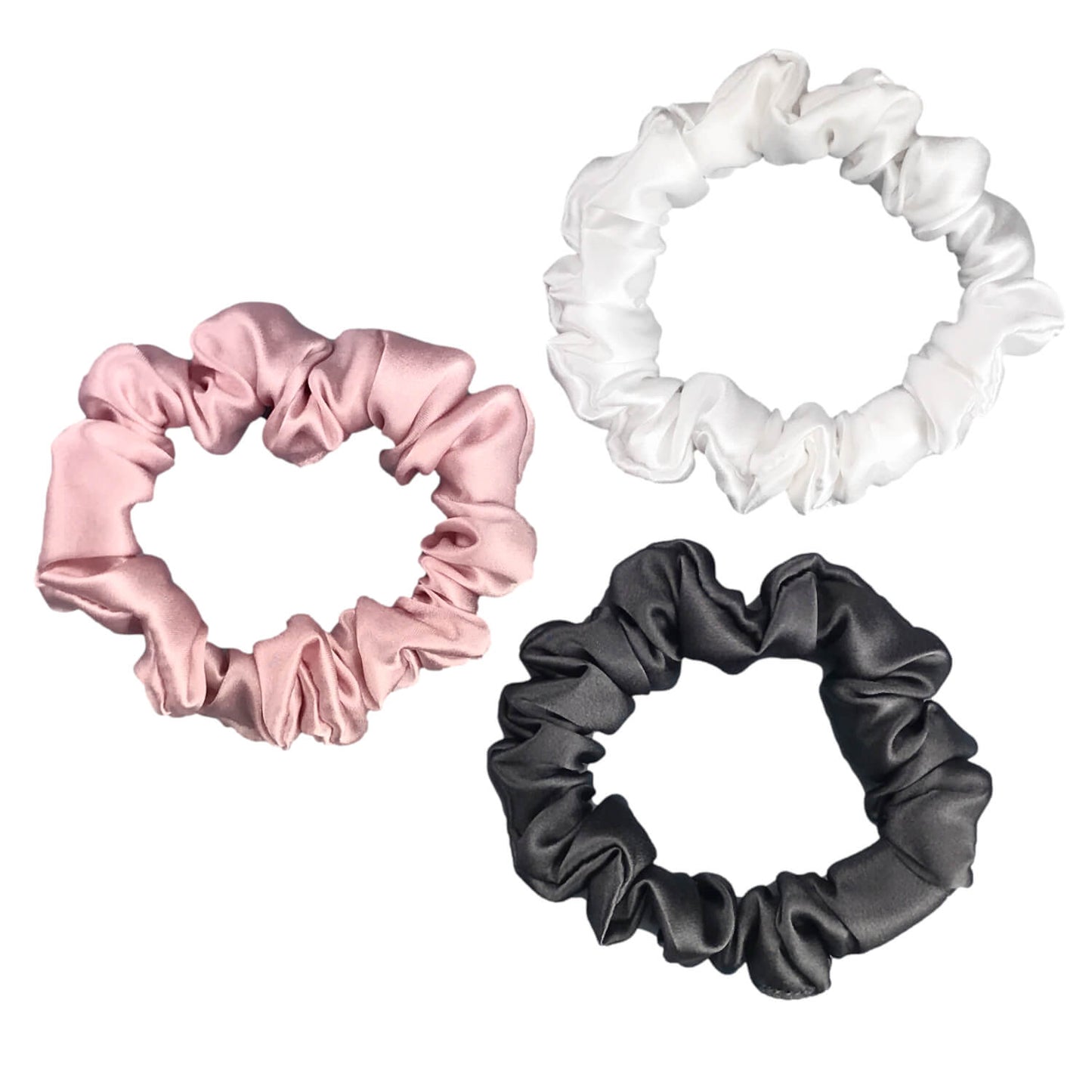 Charcoal ivory and pink silk scrunchies by celestial silk stacked with a white background