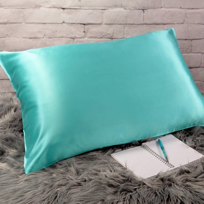 Celestial Silk Aqua 25 momme Silk Pillowcase on rug with notebook and pretty pen