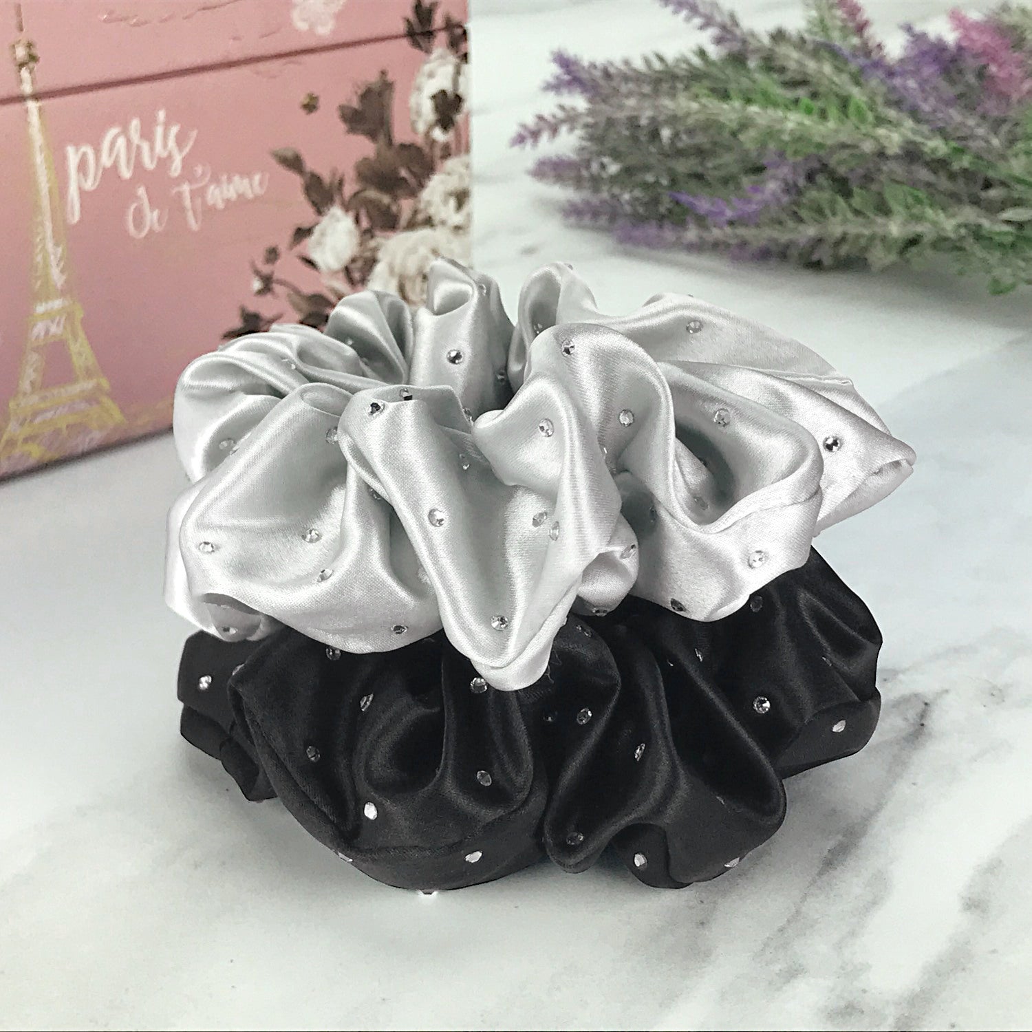 Celestial Silk scrunchies with crystals, silk hair ties with rhinestones black and silver silk hair scrunchies on marble surface with lavender and pink jewelry box