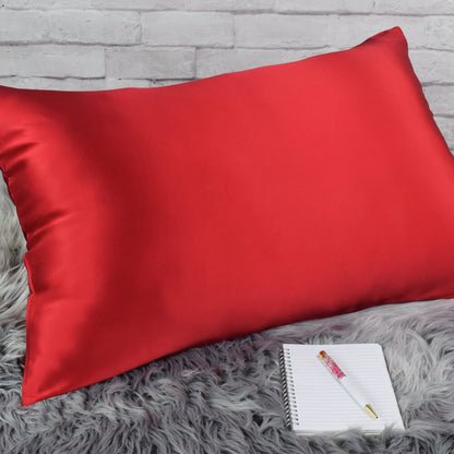 Celestial Silk Bright Red 25 momme Silk Pillowcase on rug with notebook and pretty pen