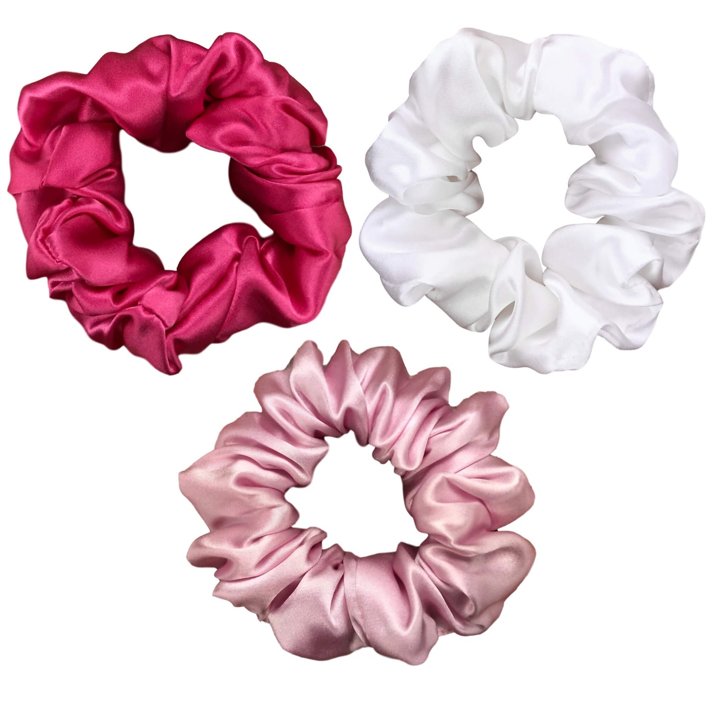 Soft pink hot pink and white silk scrunchies by celestial silk with a white background