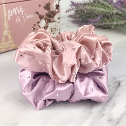 Celestial Silk scrunchies with crystals, silk hair ties with rhinestones pink and purple silk hair scrunchies on marble vanity with lavender plant and pink jewelry box