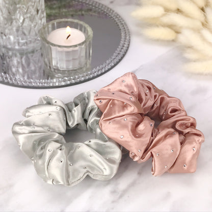 Celestial Silk scrunchies with crystals, silk hair ties with rhinestones pink and silver silk hair scrunchies on marble vanity with candle and mirror tray
