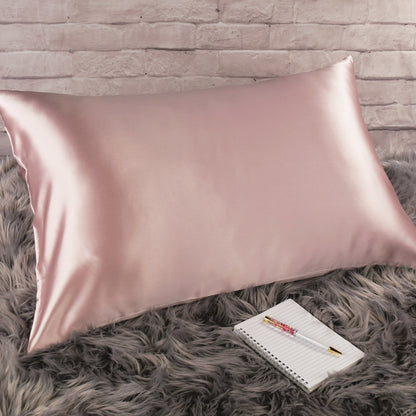 Celestial Silk 25 momme pink silk pillowcase on faux fur rug with notebook and pretty pen