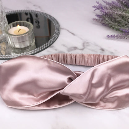 celestial silk twisted vintage pink silk headband for hair on counter with lavender and mirror tray