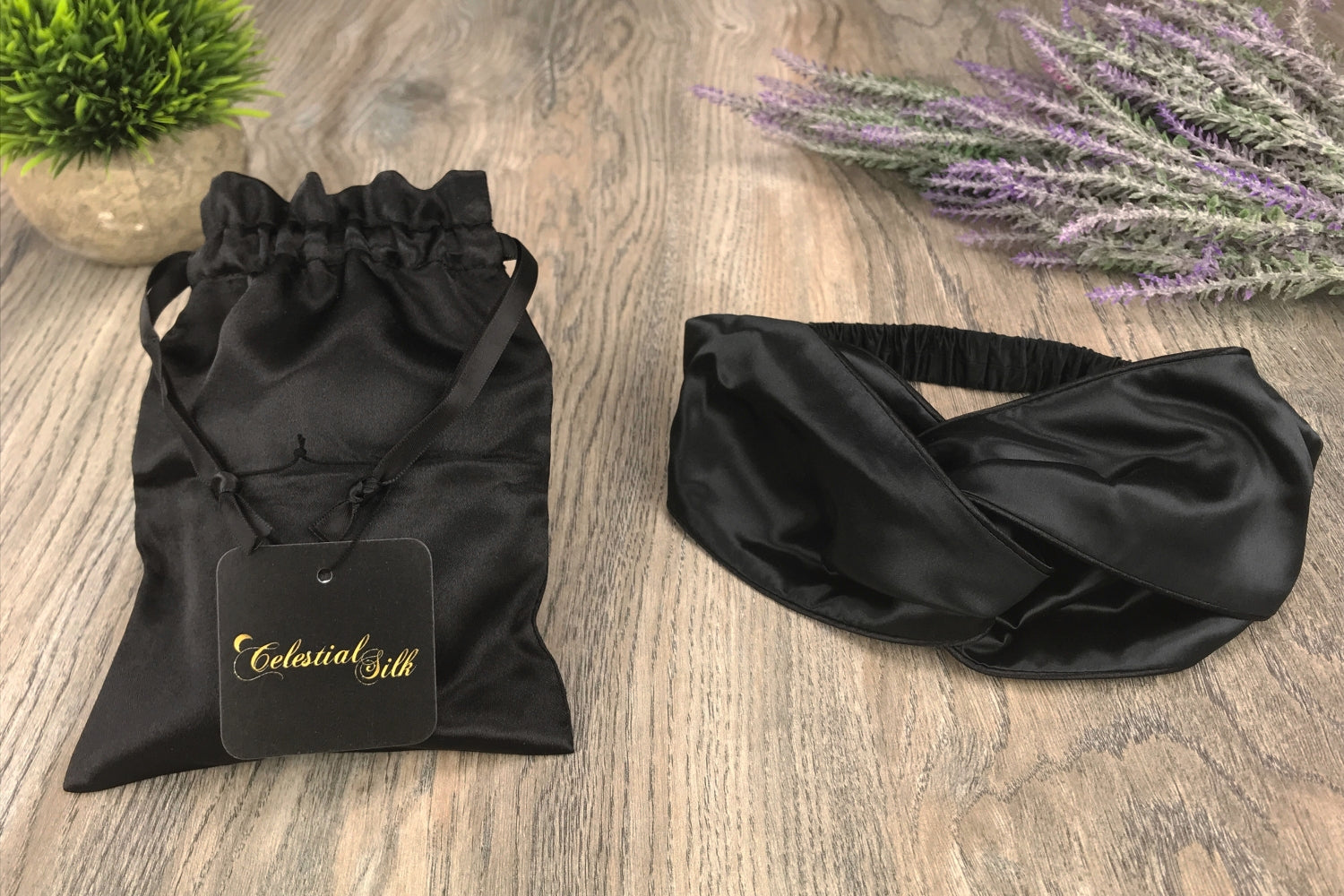 celestial silk twisted silk headband for hair on counter with lavender and satin bag
