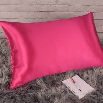 Celestial Silk Hot pink 25 momme Silk Pillowcase on rug with notebook and pretty pen