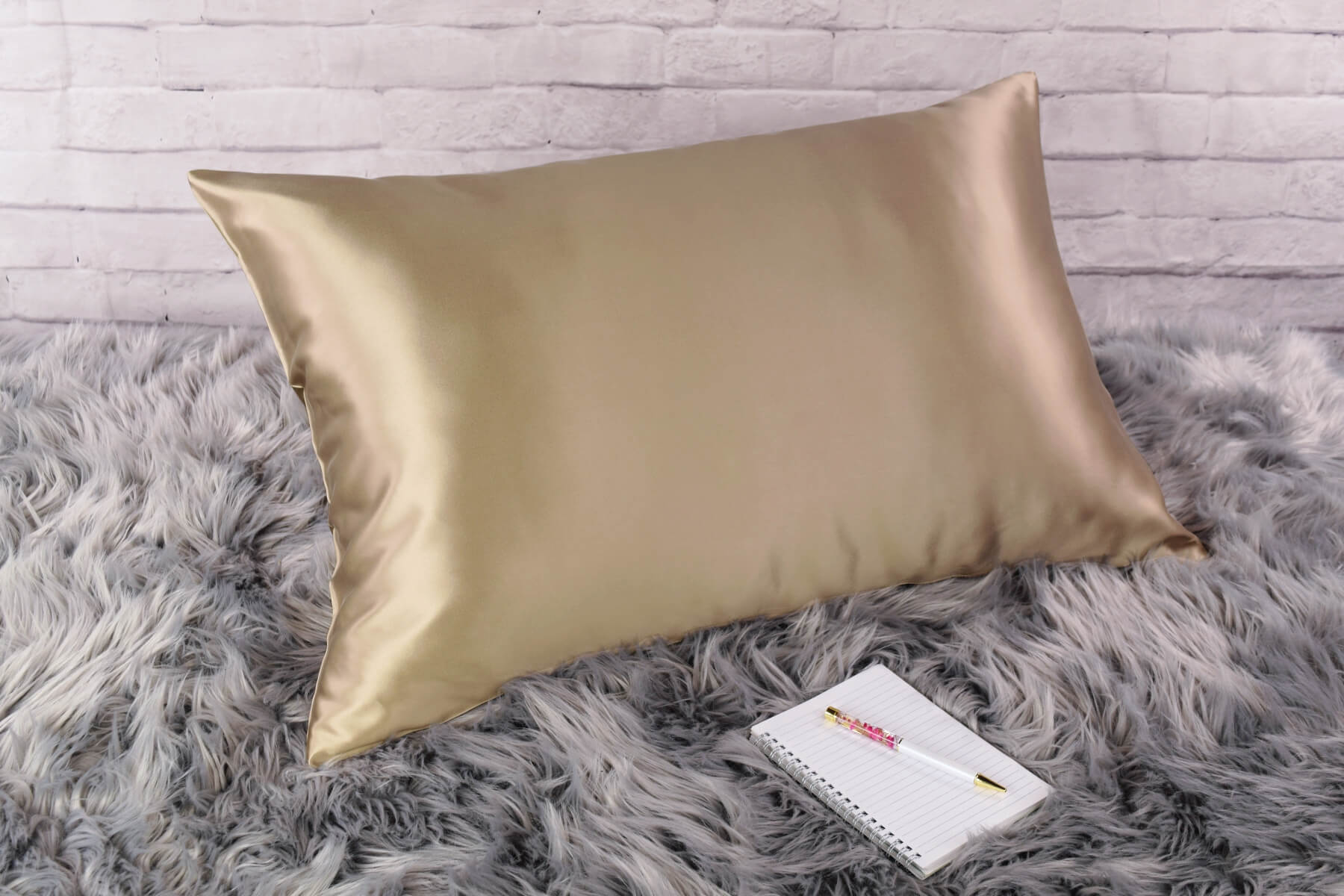 Celestial Silk Dark taupe 25 momme Silk Pillowcase on rug with notebook and pretty pen