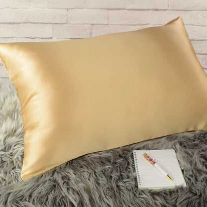 Celestial Silk Gold 25 momme Silk Pillowcase on rug with notebook and pretty pen