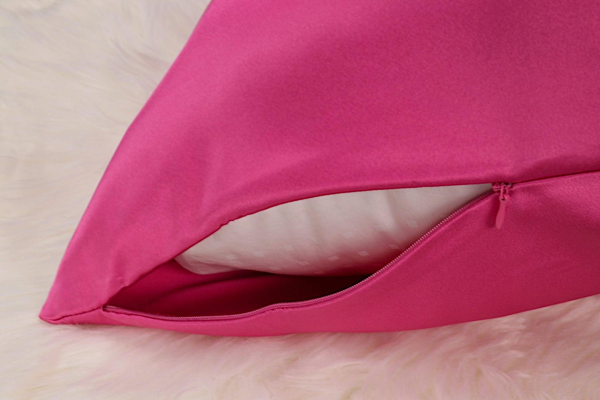 Celestial Silk Hot Pink 25 momme silk pillowcase with hidden zipper on faux fur rug