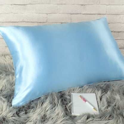 Celestial Silk Icy blue 25 momme Silk Pillowcase on rug with notebook and pretty pen