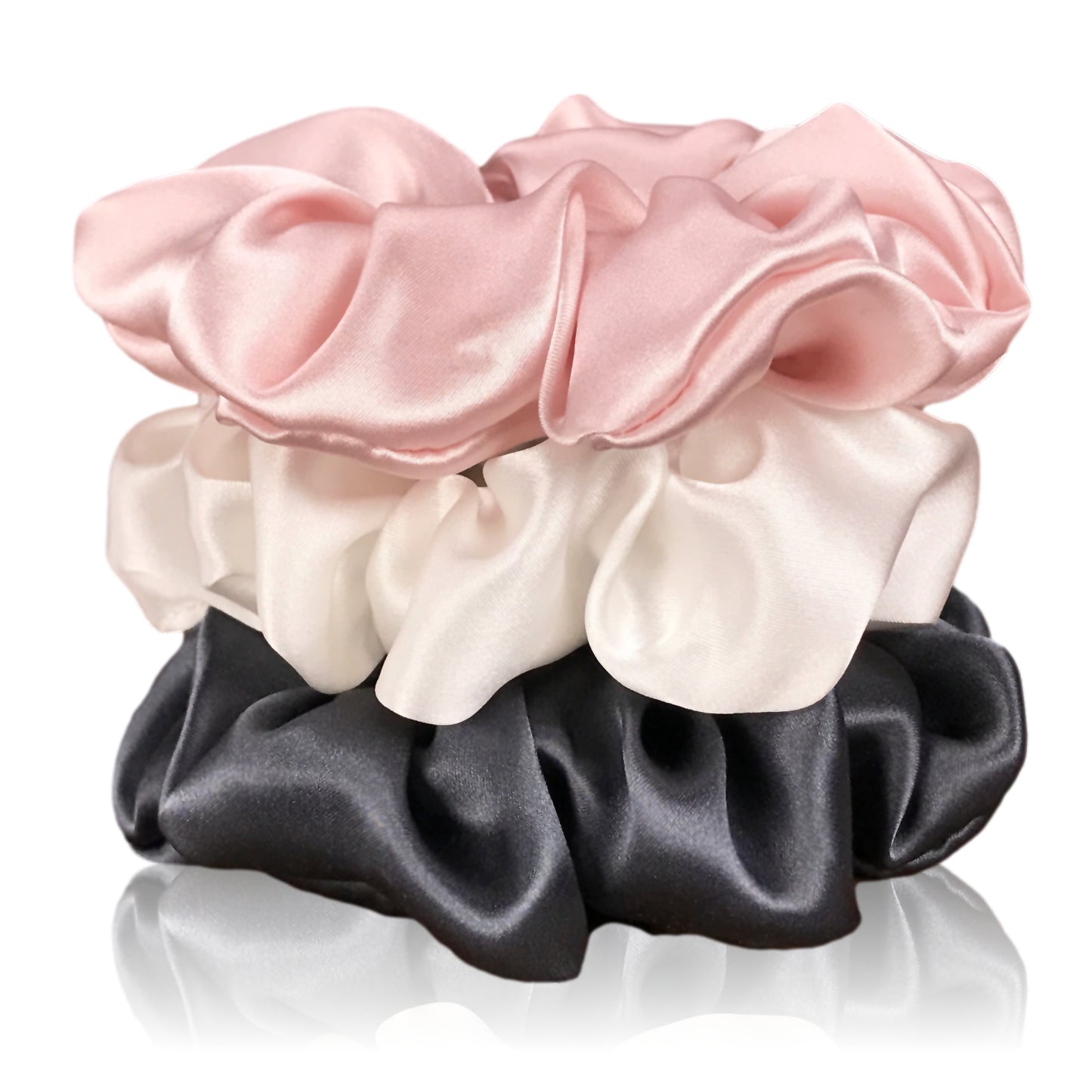 Charcoal ivory and pink silk scrunchies by celestial silk stacked with a white background