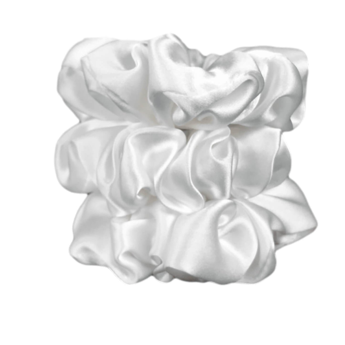 White silk scrunchies by celestial silk stacked with a white background