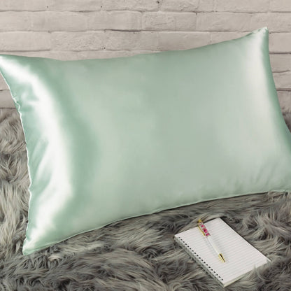 Celestial Silk 25 momme mint green silk pillowcase on faux fur rug with notebook and pretty pen