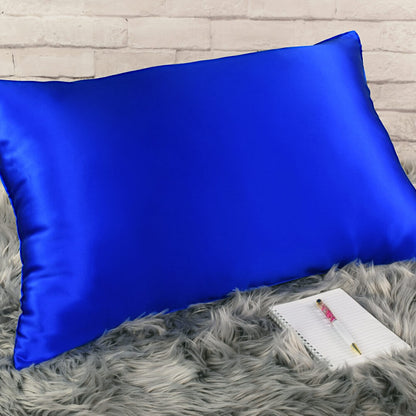 Celestial Silk 25 momme royal blue silk pillowcase on faux fur rug with notebook and pretty pen