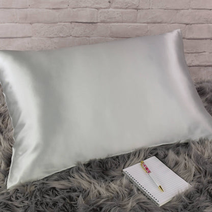Celestial Silk 25 momme silver silk pillowcase on faux fur rug with notebook and pretty pen