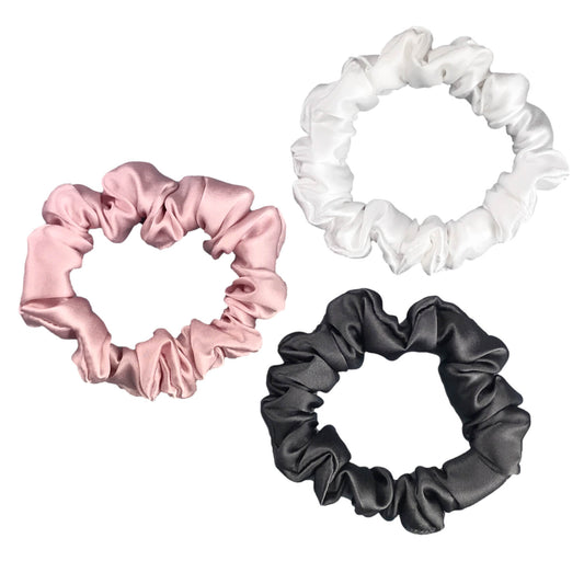 Charcoal ivory and pink silk scrunchies by celestial silk stacked with a white background