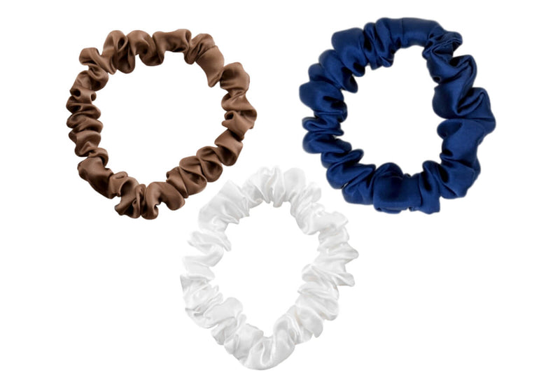 Dark taupe navy and ivory silk scrunchies by celestial silk stacked with a white background