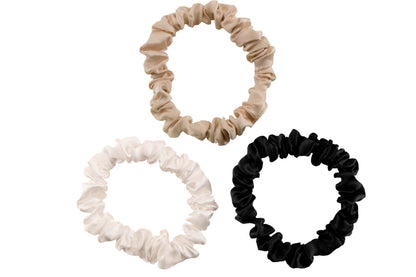 Taupe ivory and black silk scrunchies by celestial silk stacked with a white background