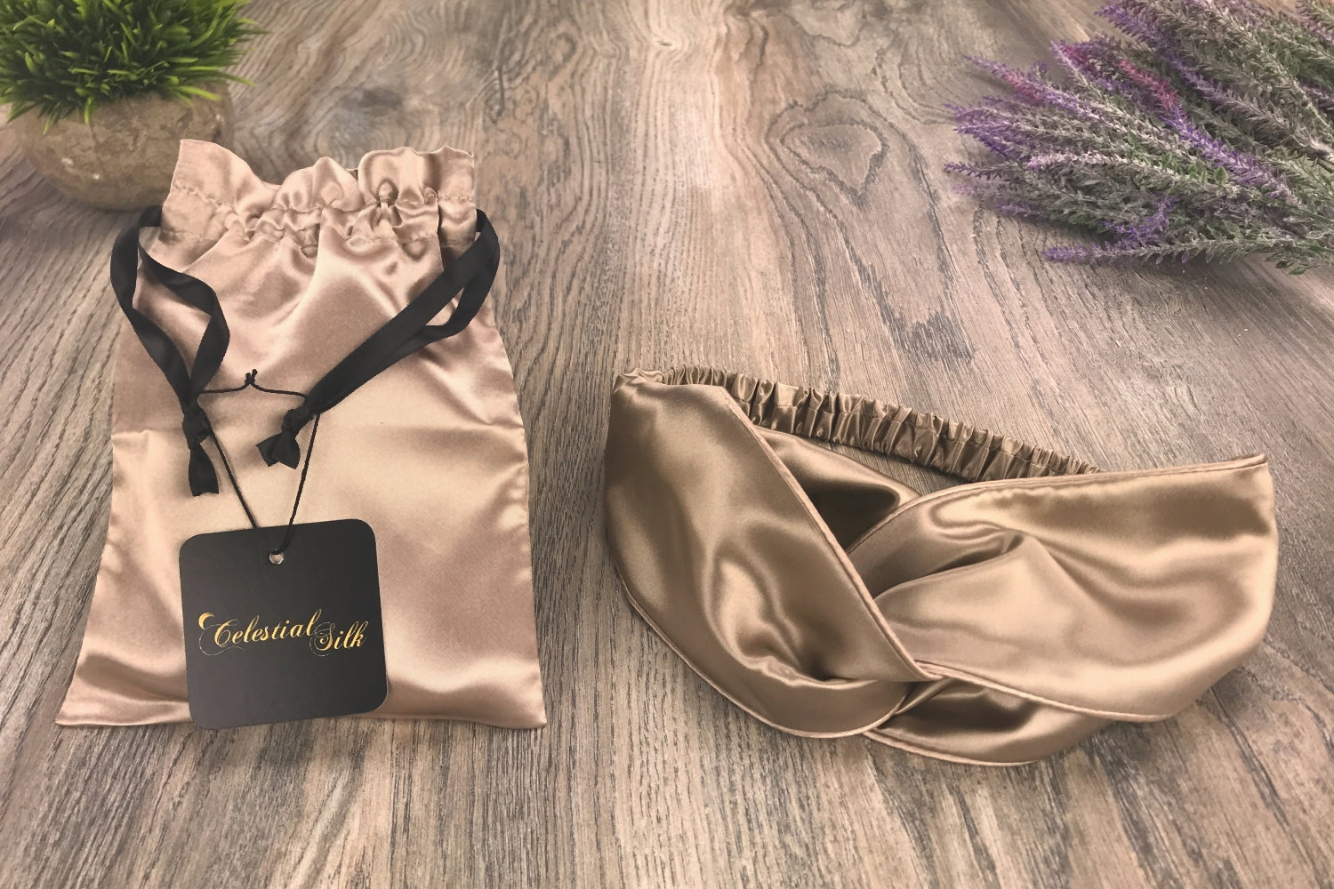 celestial silk twisted taupe silk headband for hair on counter with lavender and satin gift bag