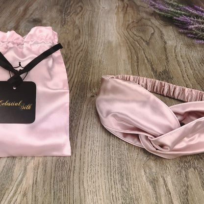 celestial silk twisted vintage pink silk headband for hair on counter with lavender and satin gift bag