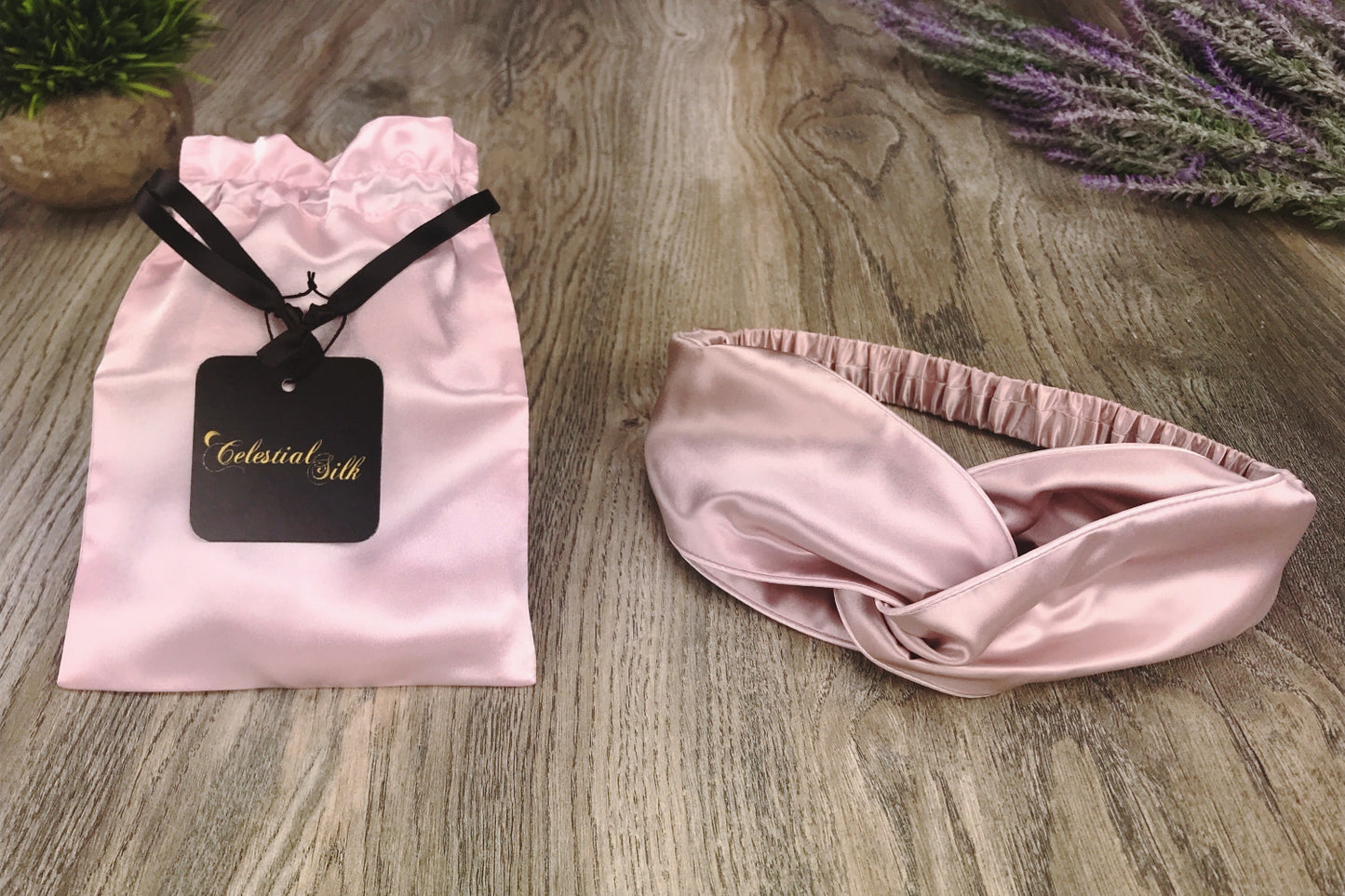 celestial silk twisted vintage pink silk headband for hair on counter with lavender and satin gift bag